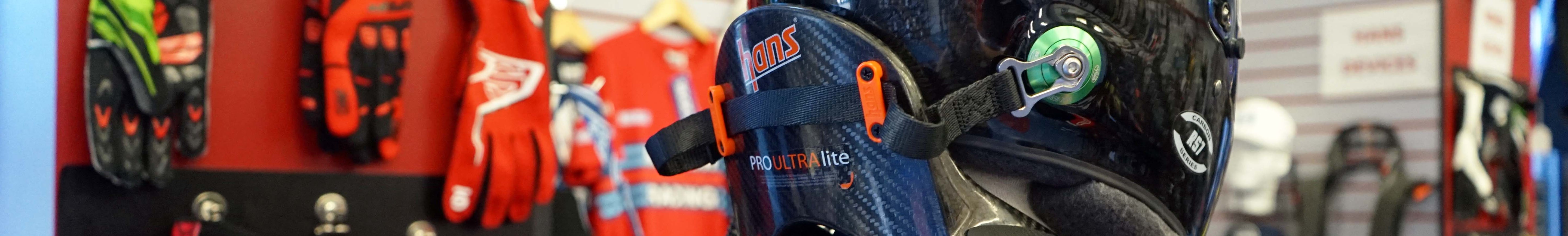 HANS Device head and neck restraint systems used in professional auto racing safety applications