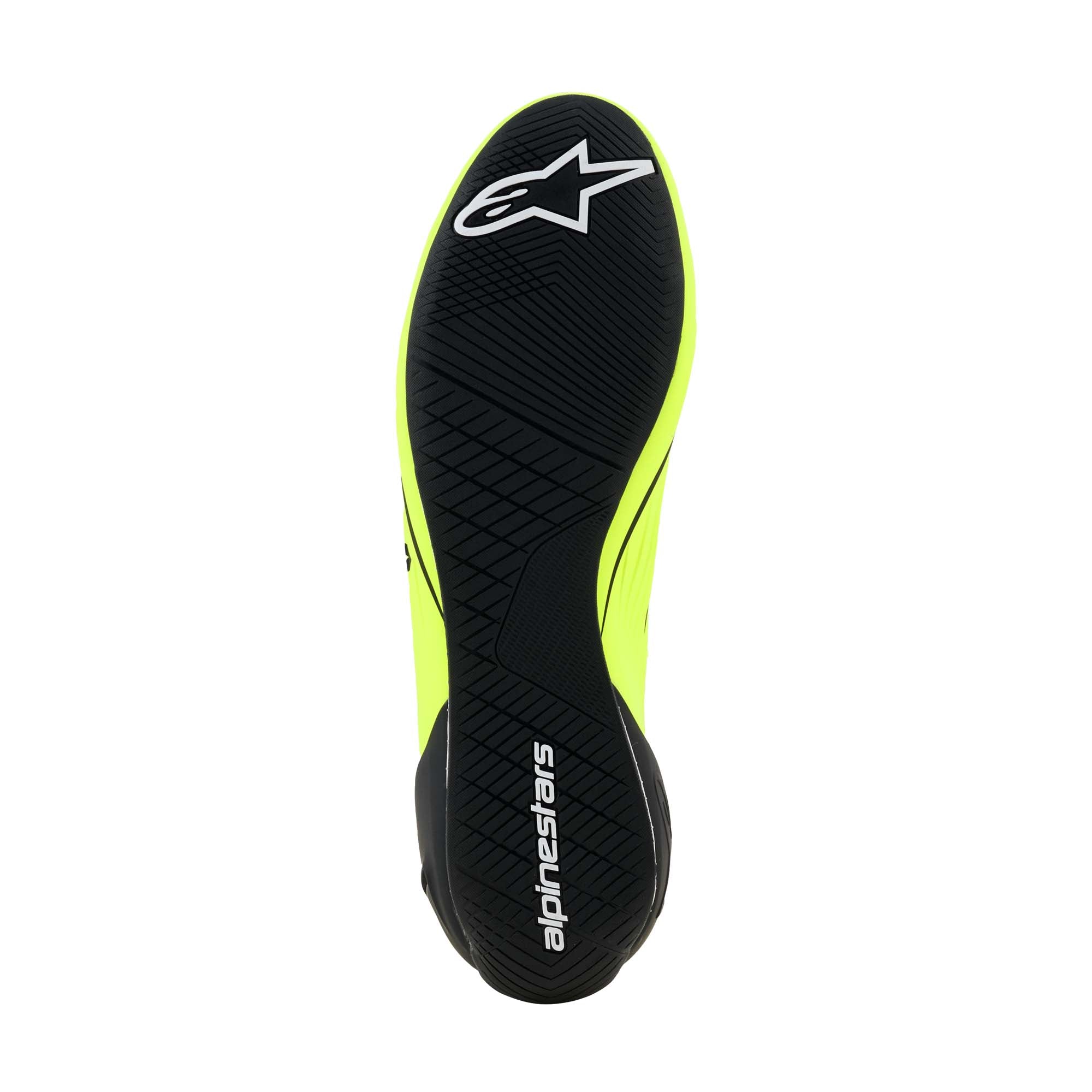 Alpinestars Supertech K FIA Karting Shoes in Yellow Fluo/Black/White, sole view showing F1-derived ultra-thin rubber outsole with asymmetric water-repelling tread pattern.